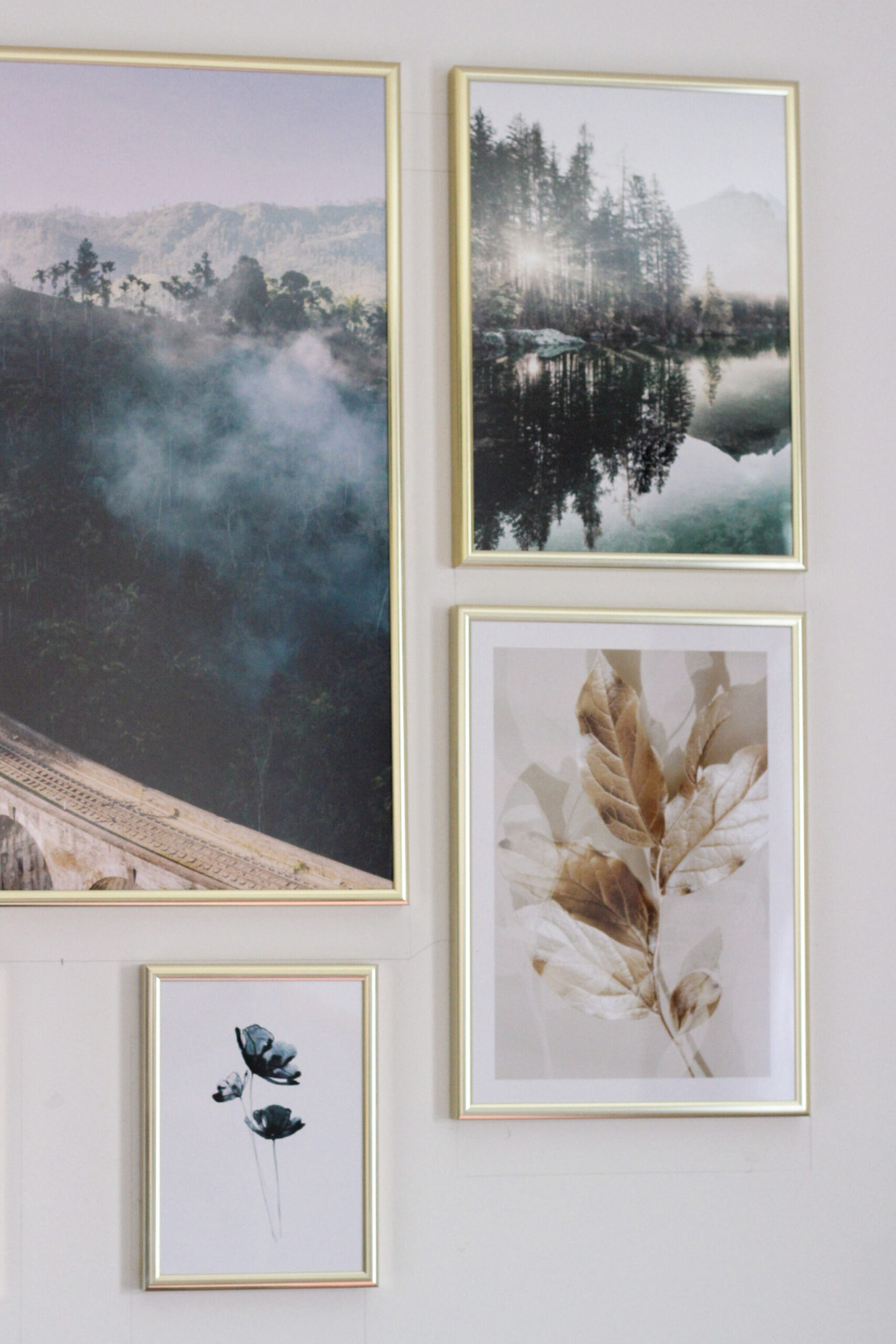 Gallery wall featuring forests, flowers and golden leaves